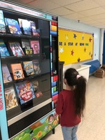 EPB STUDENTS ENJOYING THEIR NEW BOOK VENDING MACHINE!